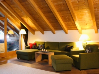 5 Catered chalet Dorferapartment Gerlos Woonkamer 1